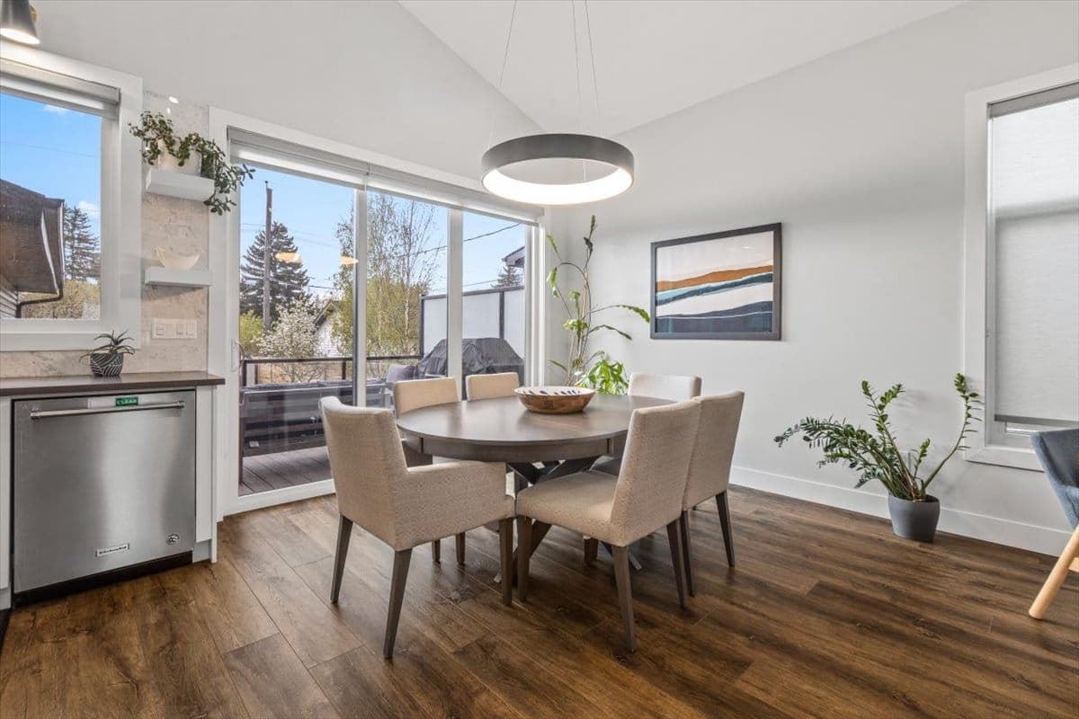 A calm consultation across a table with warm natural light