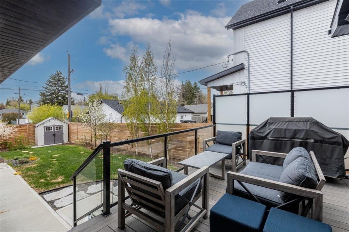 A rooftop deck looking out over an established Edmonton neighbourhood